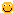 a pixelated smiley face with a slight smile on it .