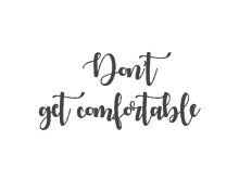 a sign that says " do n't get comfortable " in cursive on a white background