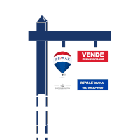 a re / max sign with a hot air balloon hanging from it