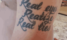 a tattoo that says real eyes realize real lies