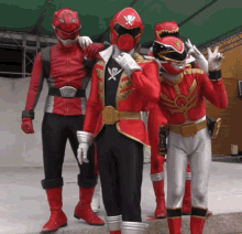 a group of red and black power rangers are posing for a photo