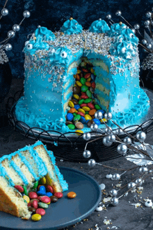 a cake with a slice taken out of it and candy coming out of it