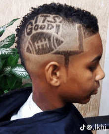 a young boy with a shaved design in his hair that says it 's good