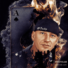 a man wearing a hat that says dj lucky stands in front of an ace of spades card