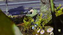 a man in a green jacket is holding a sniper rifle in the woods