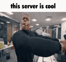 a man is dancing in an office with the words this server is cool below him