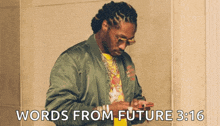 a man in a green jacket is looking at his phone with the words words from future 3:16 above him