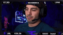 a man wearing headphones and a microphone is on a screen that says nickmercis