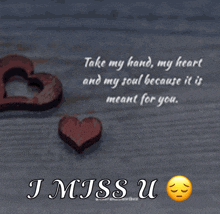 a picture of two wooden hearts and a quote that says i miss u