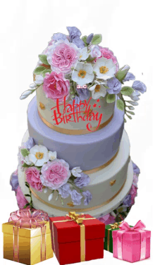 a birthday cake with pink and white flowers and the words happy birthday