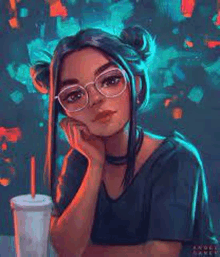 a girl wearing glasses and buns is sitting at a table with a drink in her hand .