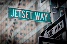 jetset way street sign next to a one way street sign