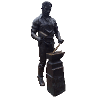 a bronze statue of a man holding a hammer and an anvil