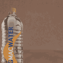 a bottle of bigmac water with a blue and orange stripe