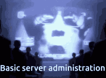 a group of people looking at a screen with the words basic server administration on it