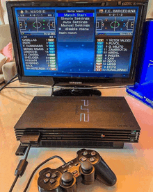 a samsung ps2 video game console with two controllers attached