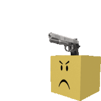 a gun is sitting on top of a box with an angry face on it