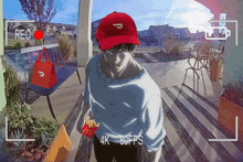 a man wearing a red hat is holding a bag of mcdonalds french fries