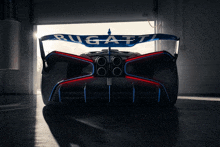 a bugatti car is parked in a garage doorway