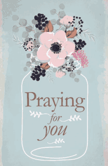 a mason jar with flowers and the words praying for you