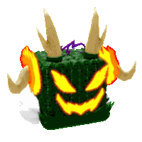 a green cube with horns and a glowing face on it