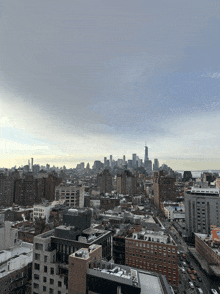 an aerial view of a city with a skyline in the background