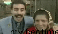 a man and a woman are posing for a picture with the words " my bedtime " in the corner