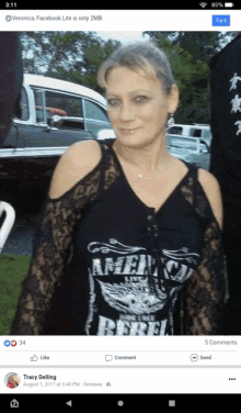 a woman wearing a black shirt that says rebel