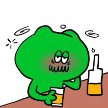 a green frog is sitting at a table with a glass of beer and a bottle of beer