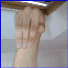 a close up of a person 's fist with three fingers