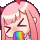 a cartoon girl with a rainbow in her mouth .