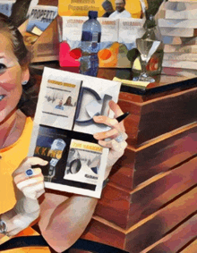 a woman in a yellow shirt is holding a book that says " the talkshow " on it