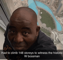 a picture of a man with the caption " had to climb 148 storeys to witness the historic w bossman " on the bottom