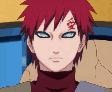 a man with red hair has a tattoo on his face