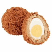 two fried scotch eggs , one of which is cut in half , on a white background .