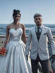 a bride in a white dress and a groom in a white suit