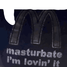 a mcdonald 's logo with the words masturbate i 'm lovin ' it on it