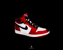 a pair of red and white nike air jordans