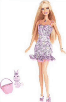 a blonde barbie doll in a purple dress is next to a pink bunny