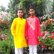 a man in a yellow shirt and a man in a red shirt are standing next to each other