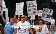 a group of people are holding signs that say fat is not a four letter word