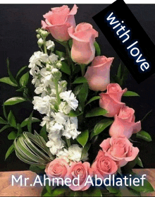 a bouquet of pink roses and white flowers with the name mr.ahmed abdlatief