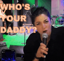 a woman singing into a microphone with the words who 's your daddy