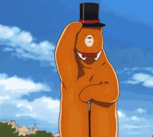 an orange teddy bear with a top hat and bow tie