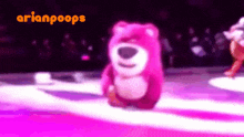 a pink teddy bear is dancing in front of a sign that says arianpops