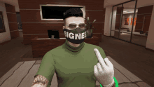 a man wearing a mask that says " bigne " giving the middle finger