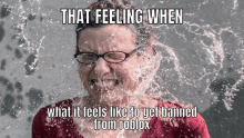 a woman with glasses is splashed with water and the caption that feeling when what it feels like to get banned from roblox