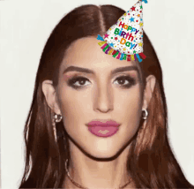 a woman wears a birthday hat that says happy birthday