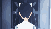 the back of a girl 's head with a white bow in her hair