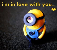 a picture of a minion with the words " i 'm in love with you " above it